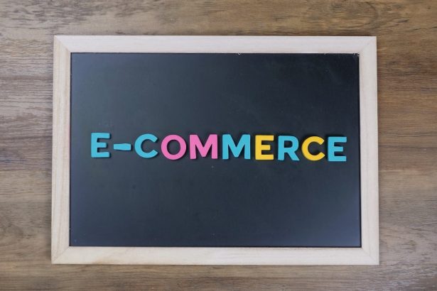 Colorful letters spelling 'e-commerce' on a wooden framed blackboard.